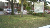 Lawn and sign outside Walnut Garden Apartment complex