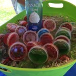 Basket of Jell-O shots with a bottle of pinnacle whip vodka
