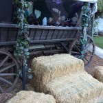 Hay bales leading up to a wagon